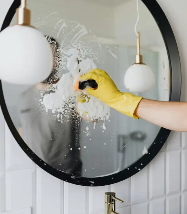 Professional house cleaning service in Heber City — bathroom mirror cleaning by Xquisite Homes