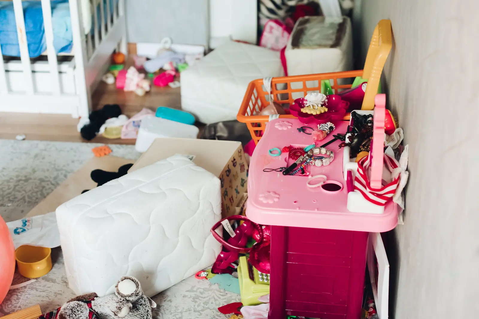 Cluttered children's room before a professional house cleaning service in Heber City