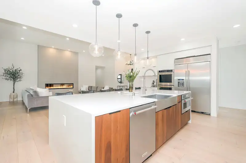 Luxury Park City home kitchen with marble island and stainless appliances ready for professional move-in cleaning before unpacking