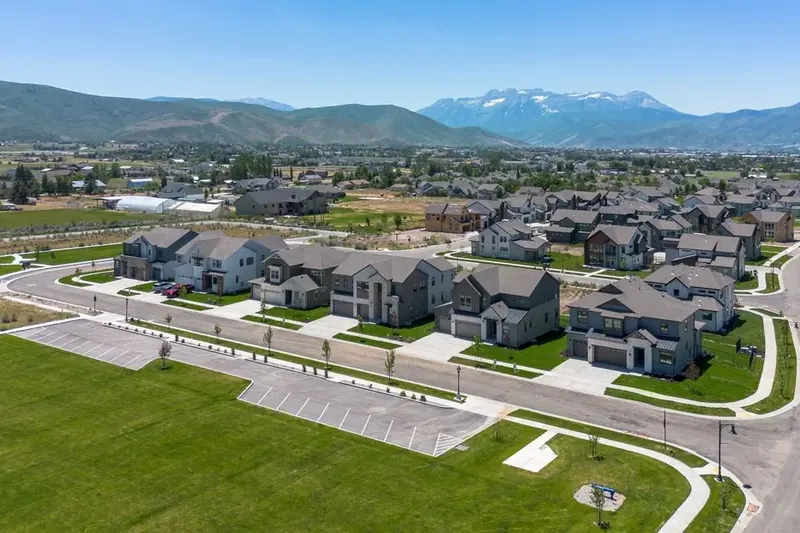 cleaning-services-oakley-utah Aerial view of a residential neighborhood with mountain backdrop in Oakley, Utah, covered by our cleaning services