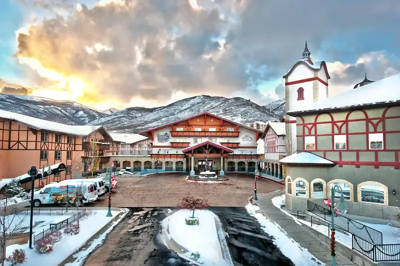 Swiss-style buildings with snow-capped mountains in Midway, Utah, part of our house cleaning service area