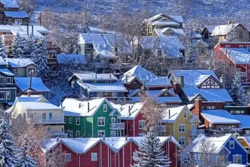 Colorful hillside homes covered in snow near Kamas, Utah, a service area for our house cleaning company